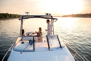 family on a boat at sunset