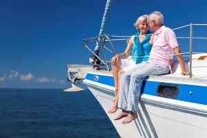 older man and woman sitting on a boat