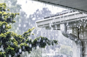 rain pouring out of gutters